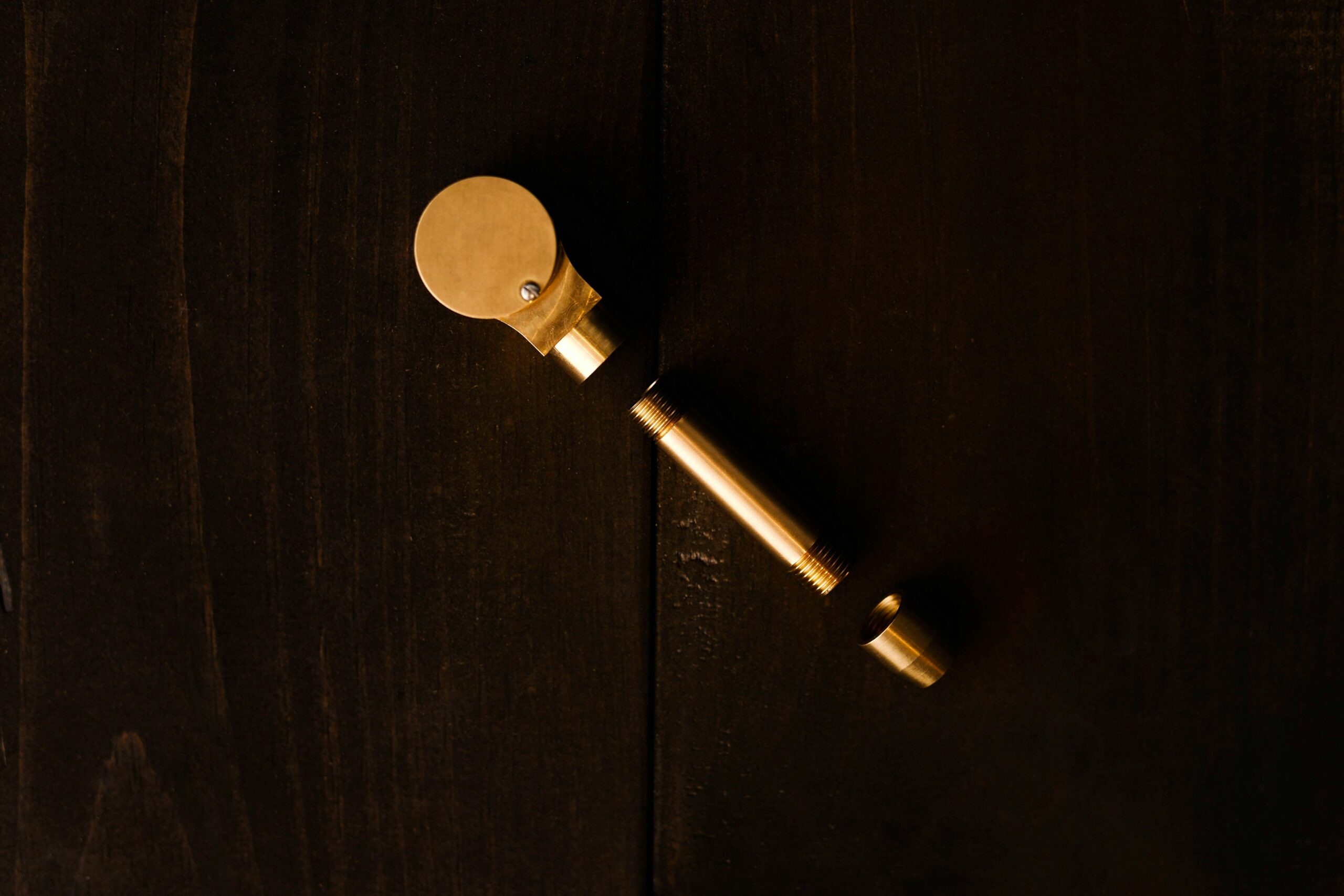 Gold key on brown wooden table