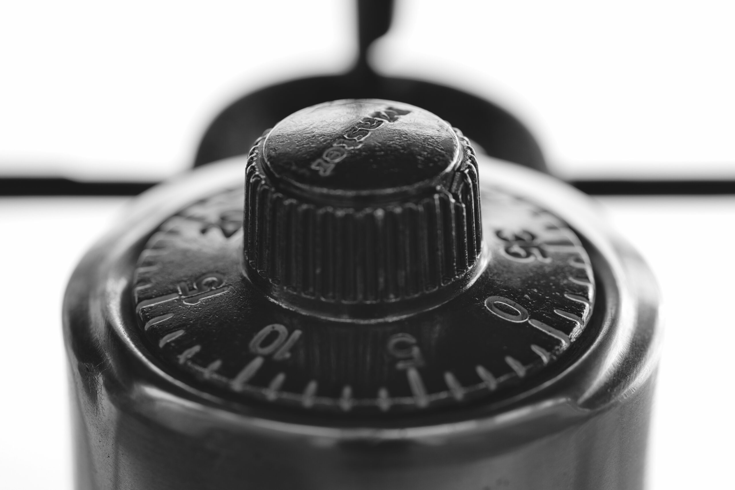 A close up of a black and white photo of a compass