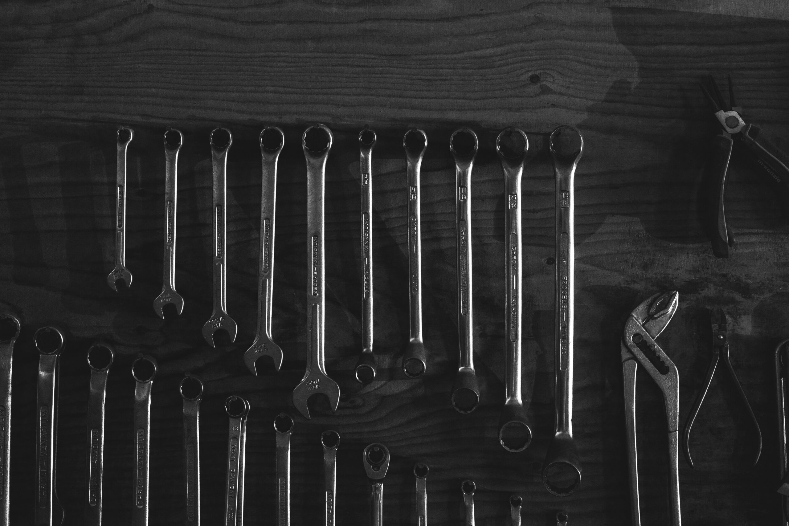 Silver skeleton keys on black surface