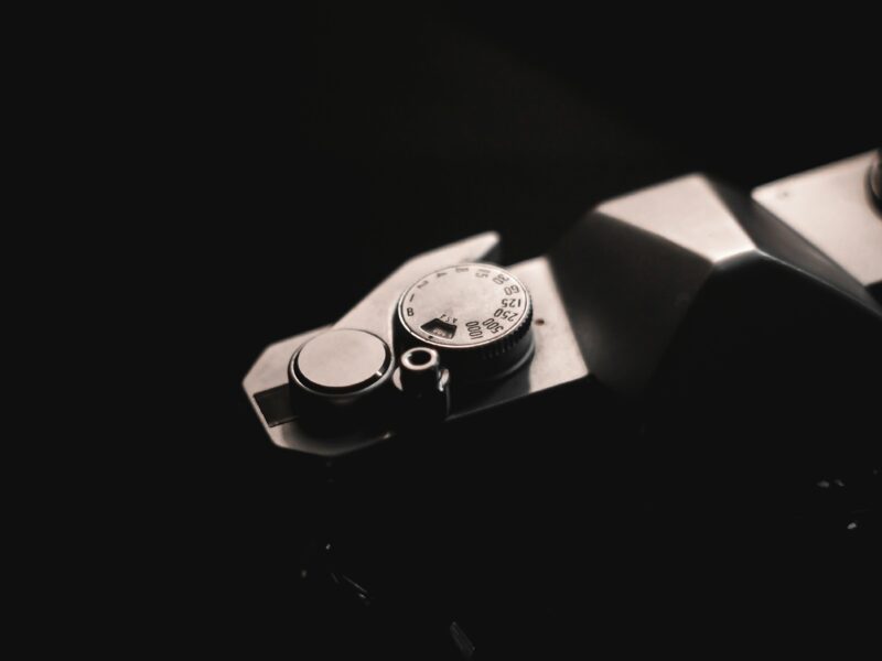 A close up of a watch on a black surface