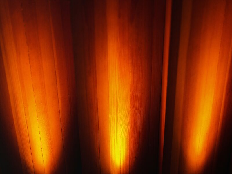 A close up of a curtain with light coming through it