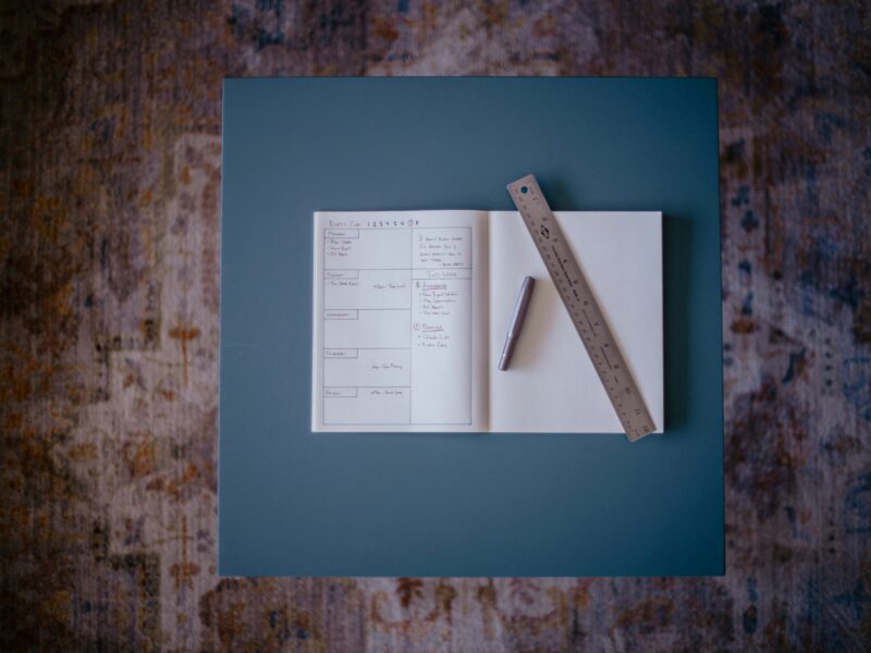 A book with a ruler on top of it