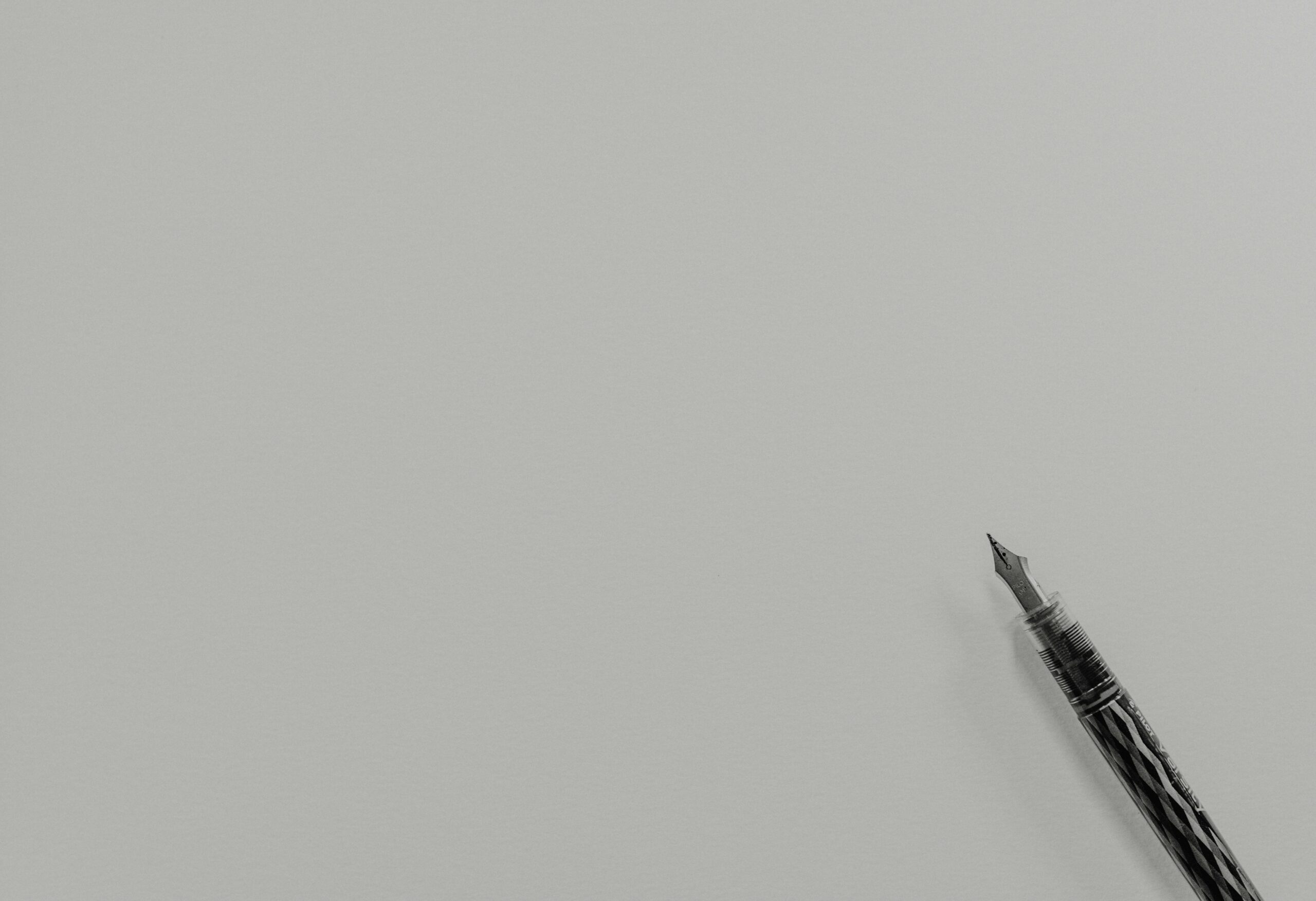 Grayscale photo of fountain pen